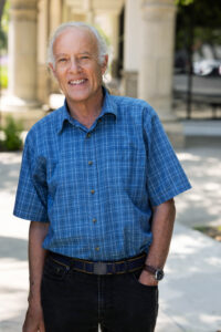 Stephen Turnbull wearing dark pants and a blue checked shirt